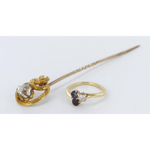 145 - 22ct topped stick pin set with a round paste stone, weight 2.8g. Yellow metal tests as 18ct ring set... 