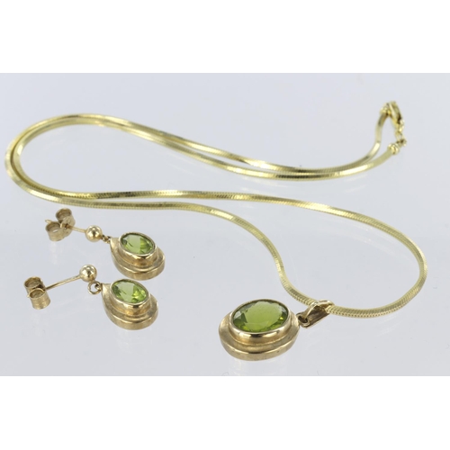 163 - Suite of 9ct yellow gold jewellery to include a pendant set with oval peridot measuring approx. 10mm... 