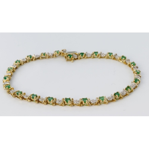 222 - 9ct yellow gold bracelet set alternately with twenty three round 2mm emeralds and twenty three round... 