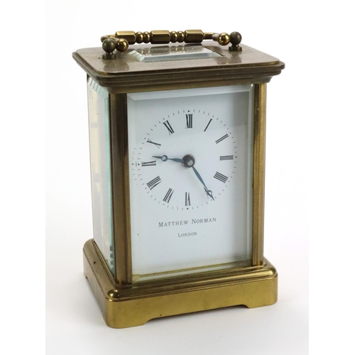 429 - Brass five glass carriage clock by 'Matthew Norman, London', white enamel dial with Roman numerals, ... 