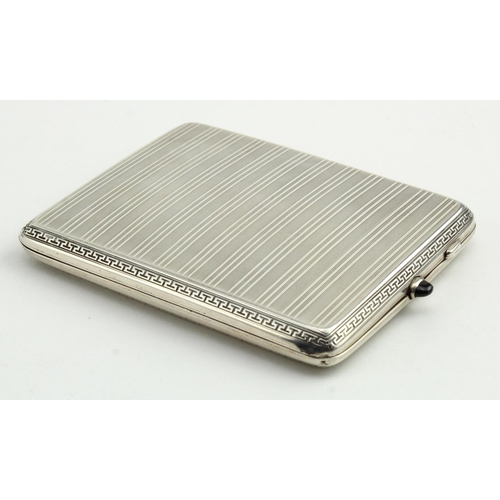 582 - Continental (possibly German), silver, engine turned, cigarette case with a concealed panel depictin... 