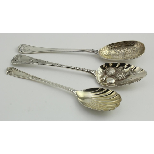 596 - Three silver fruit spoons comprising a George III berry spoon, hallmarked London 1806, Victorian spo... 