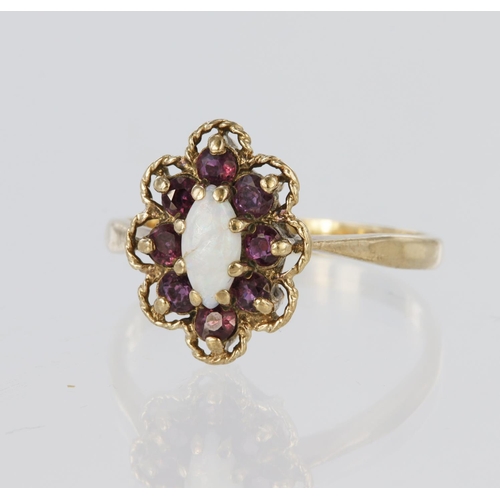 94 - 9ct yellow gold ring featuring a marquise shaped opal measuring approx. 8mm x 4mm, surrounded by eig... 