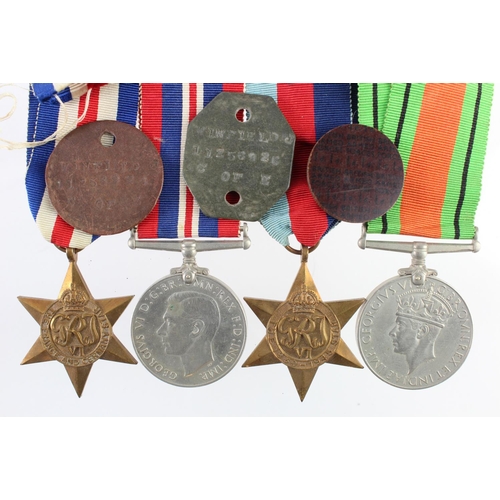 1211 - WW2 group consisting of 1939-45 star, F&G star, Defence and War medals in named box with pair of ID ... 