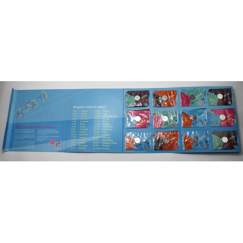 2347 - GB 50p's (29) a complete set of London 2012 Olympics, currency issues in the Royal mint folder with ... 