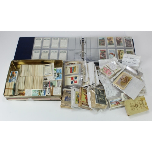 636 - White basket of various loose Cigarette card odds, silks, tin of Brooke Bond and an album of loose C... 