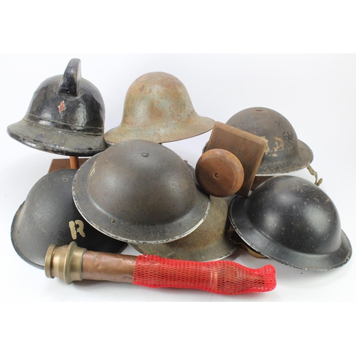 2435 - Home Front WW2 helmets, various types, plus a brass end of a Fire Hose, plus 4x wooden hat stands. (... 