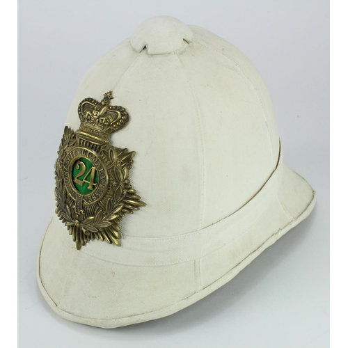 2538 - Pith Helmet a restored example re blanched, carries 24th Foot Helmet plate, complete with liner & ch... 