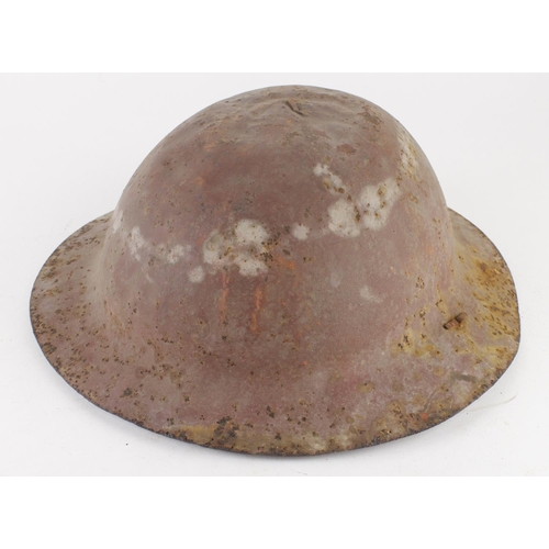 2700 - WW1 British raw edge Brodie helmet with lining in semi relic condition, possibly officer.