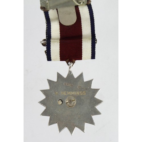 2365 - Corps of Commissionaires Medal, silver hallmarked (1967) and enamel, named 'W Hemmings'.