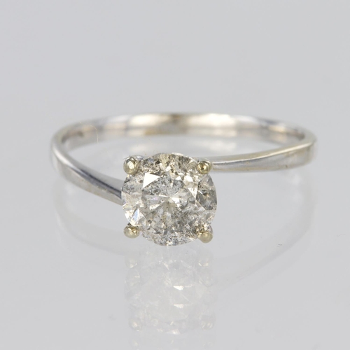 1 - White metal solitaire ring set with a round brilliant cut diamond weighing approx. 1.0ct in a four c... 