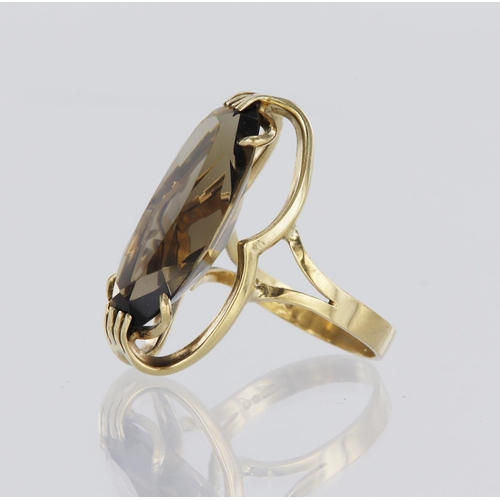 101 - 9ct yellow gold dress ring set with an elongated oval smoky quartz measuring approx. 25mm x 13mm, fi... 