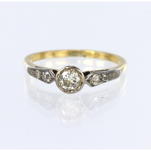 107 - 18ct yellow gold ring set with a round brilliant cut diamond in an illusion rub over setting, with t... 