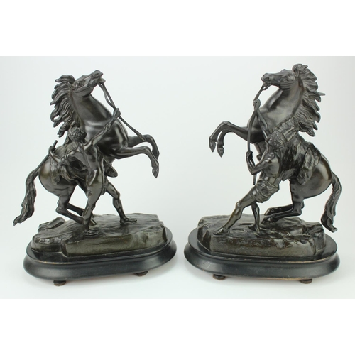 1158 - After Guillaume Cousteau. A pair of bronze Marley horses, each signed, mounted on wood bases, total ... 