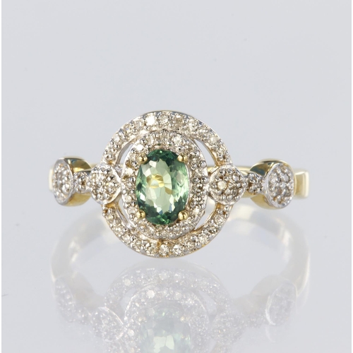 119 - 14ct yellow gold ornate cluster ring set with a central green stone measuring approx. 6mm x 4mm surr... 