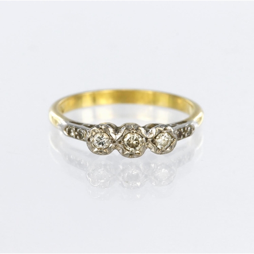 132 - 18ct yellow gold and platinum ring set with three round brilliant cut diamonds in illusion heart sha... 