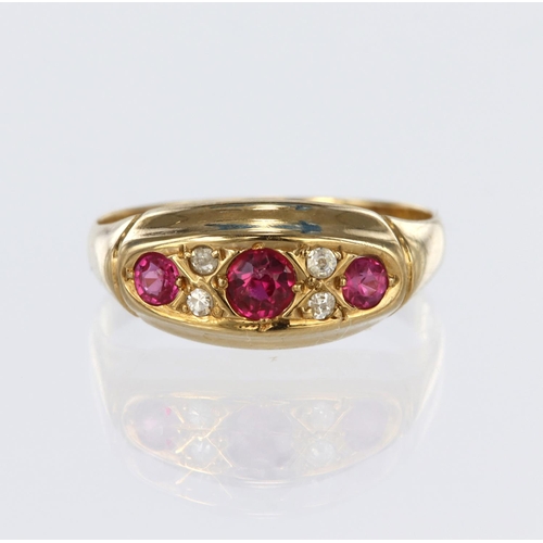 136 - 18ct yellow gold boat shaped ring set with three graduated round rubies with four round old cut diam... 