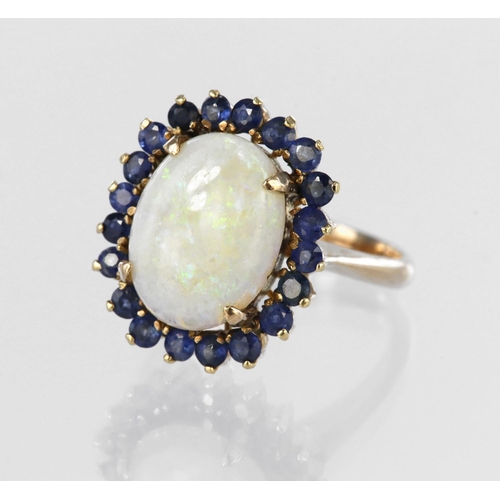 14 - 14ct yellow gold dress ring set with a central oval opal cabochon measuring approx. 13mm x 10mm in a... 