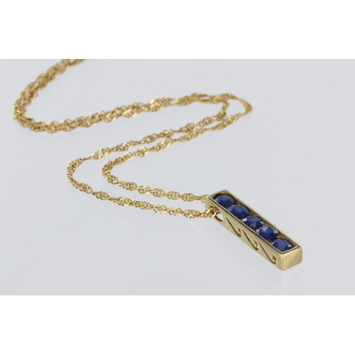 146 - 9ct yellow gold bar pendant set with five oval sapphires in a channel setting, slider style pendant ... 