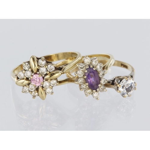 164 - Three 9ct yellow gold rings set with paste and cubic zirconia, to include a solitaire, finger size N... 