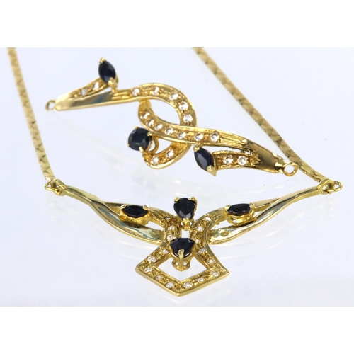 207 - Yellow metal (tests as 18ct) necklace set with sapphire and cz, on split chain with bolt ring clasp,... 