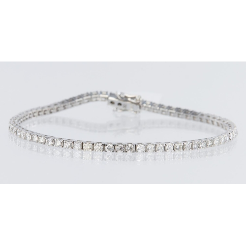 223 - 18ct white gold tennis bracelet set with sixty eight round brilliant cut diamonds totalling 2.75ct, ... 