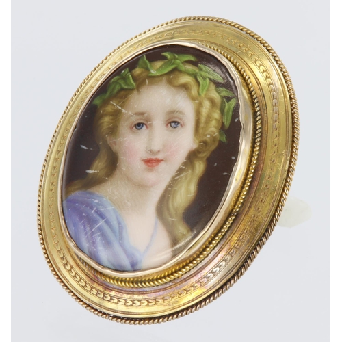 227 - Hand painted on mother of pearl, miniature portrait of a young woman set an oval yellow metal (tests... 