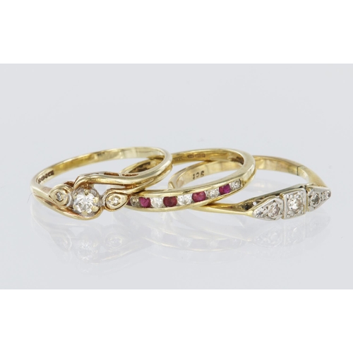 244 - Three rings to include a 9ct yellow gold ruby and diamond half eternity channel set ring, finger siz... 