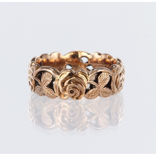 26 - 9ct rose gold 7mm wide band ring decorated with floral and foliate design, finger size O, weight 7.0... 