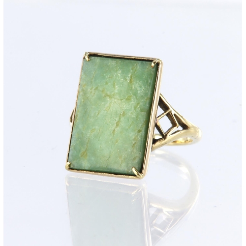 34 - 18ct yellow gold dress ring set with a rectangular green hardstone measuring approx. 19mm x 13mm, in... 