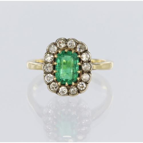 39 - 18ct yellow gold cluster ring featuring a multi claw set central octagonal step cut emerald surround... 
