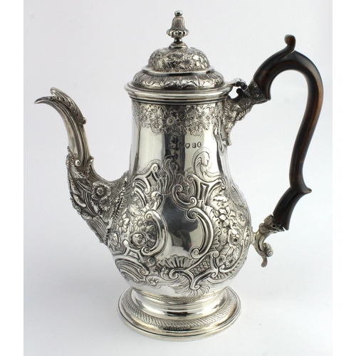 567 - George IV silver coffee pot with embossed scroll, foliate & floral decoration on a pedestal base, ha... 