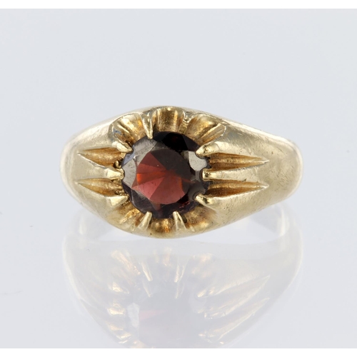 58 - 9ct yellow gold signet style ring set with a single round garnet measuring approx. 7mm in a gypsy se... 