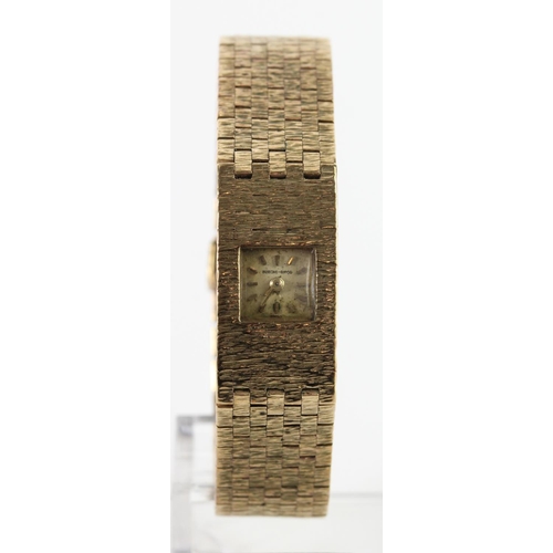 655 - Ladies 9ct cased Bueche-Girod wristwatch on an intergral 9ct bracelet. Total weight 38.6g