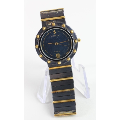 656 - Ladies quartz wristwatch by Corum. The black dial with date aperture at 6 o'clock, black & gold beze... 