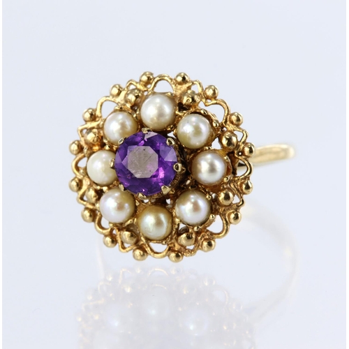 67 - 9ct yellow gold dress ring set with a central round amethyst measuring approx. 5mm diameter, surroun... 