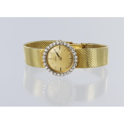 671 - Ladies Omega 18ct wristwatch, with a diamond bezel, on an 18ct Gold bracelet, total weight 43.8g app... 