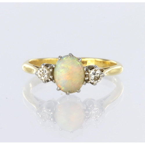 7 - 18ct yellow gold and platinum three stone ring featuring a central oval opal cabochon measuring appr... 