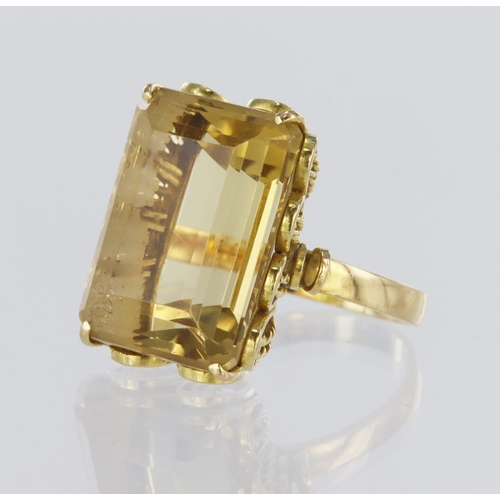 70 - 18ct yellow gold dress ring set with a single rectangular step cut citrine measuring approx. 19mm x ... 