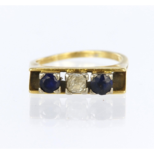 73 - Tests as 15ct yellow gold three stone ring set with a central cushion shaped old cut diamond weighin... 