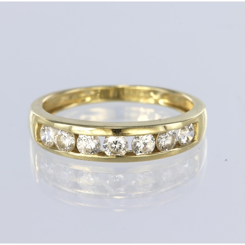 78 - 14ct yellow gold half eternity ring set with seven round cz stones in a channel setting, finger size... 