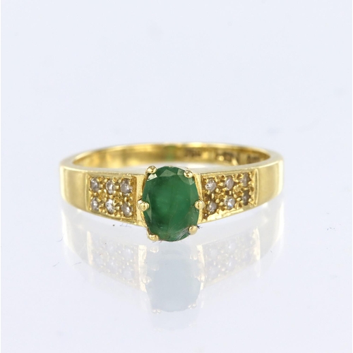 80 - 18ct yellow gold ring featuring an oval emerald measuring approx. 6mm x 4mmwith six diamond highligh... 