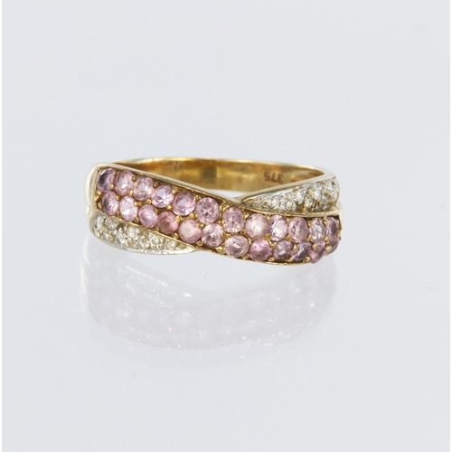 86 - 9ct yellow gold crossover style band ring set with twenty four round pink sapphires and highlighted ... 