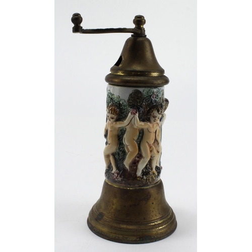 937 - Capodimonte musical pepper grinder depicting dancing cherubs. Height aprox 20cm. Working when catalo... 