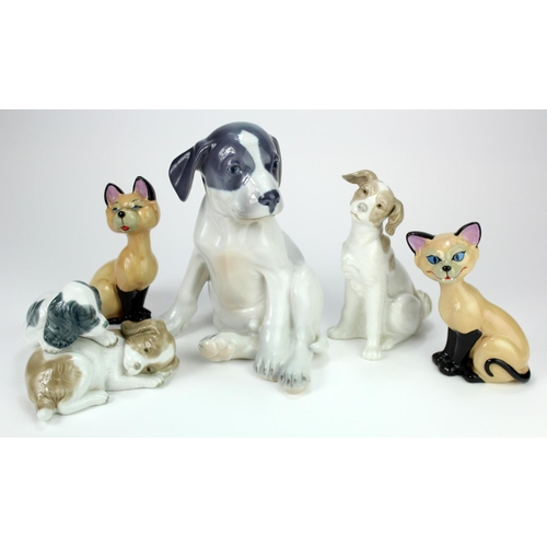 939 - Cats & dogs. A group of five porelain cat & dog figures, makers comprise Copenhagen, Wade & Lladro N... 