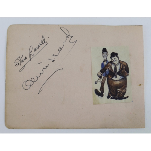 259 - Laurel & Hardy. An original autograph album page signed in ink by Stan Laurel & Oliver Hardy (with t... 