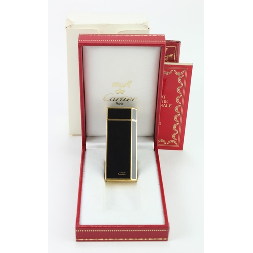 399 - Cartier. Must de Cartier black lacquered lighter, in original case & outer packaging