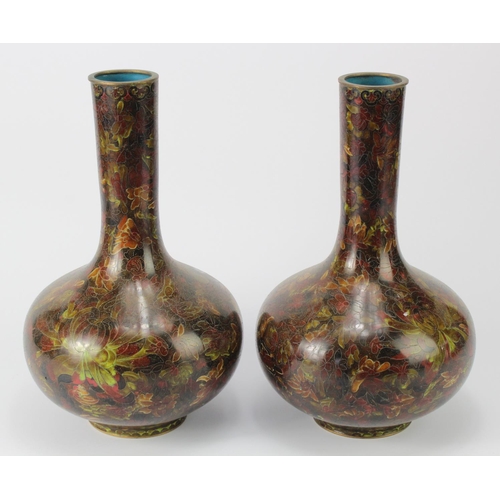 404 - Cloisonne. A pair of Japanese bottle shaped cloisonne vases (probably Meiji), decorated with chrysan... 