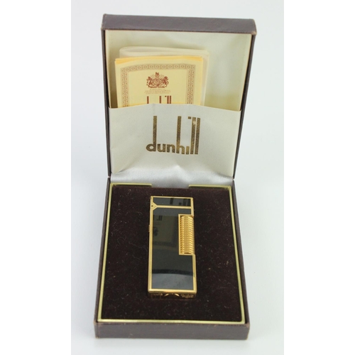 411 - Dunhill black enamel and gold plated Rollagas lighter, with documents, contained in original case