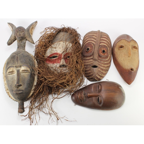 422 - Five African tribal masks, largest 51cm x 18cm approx.